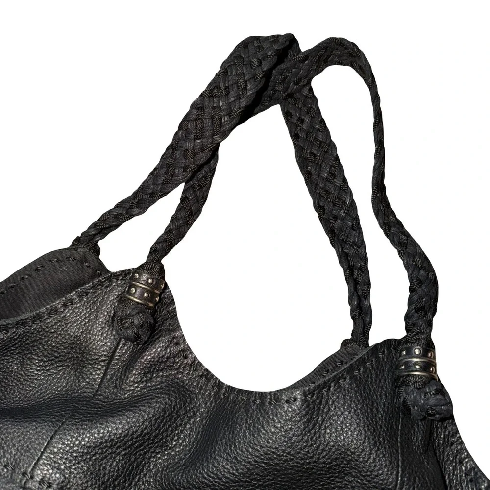 The Sak Indio black leather hobo bag, braided shoulder straps